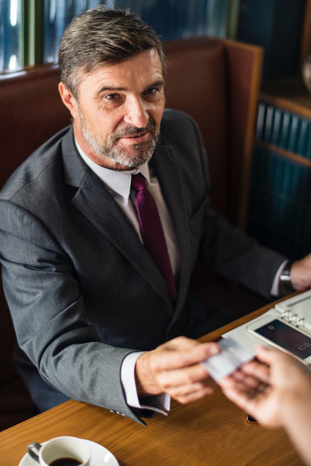 man sitting on brown task chai